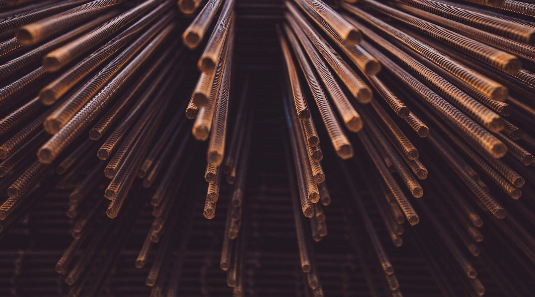 Bundles of reinforcement bar stacked end-on in a materials yard