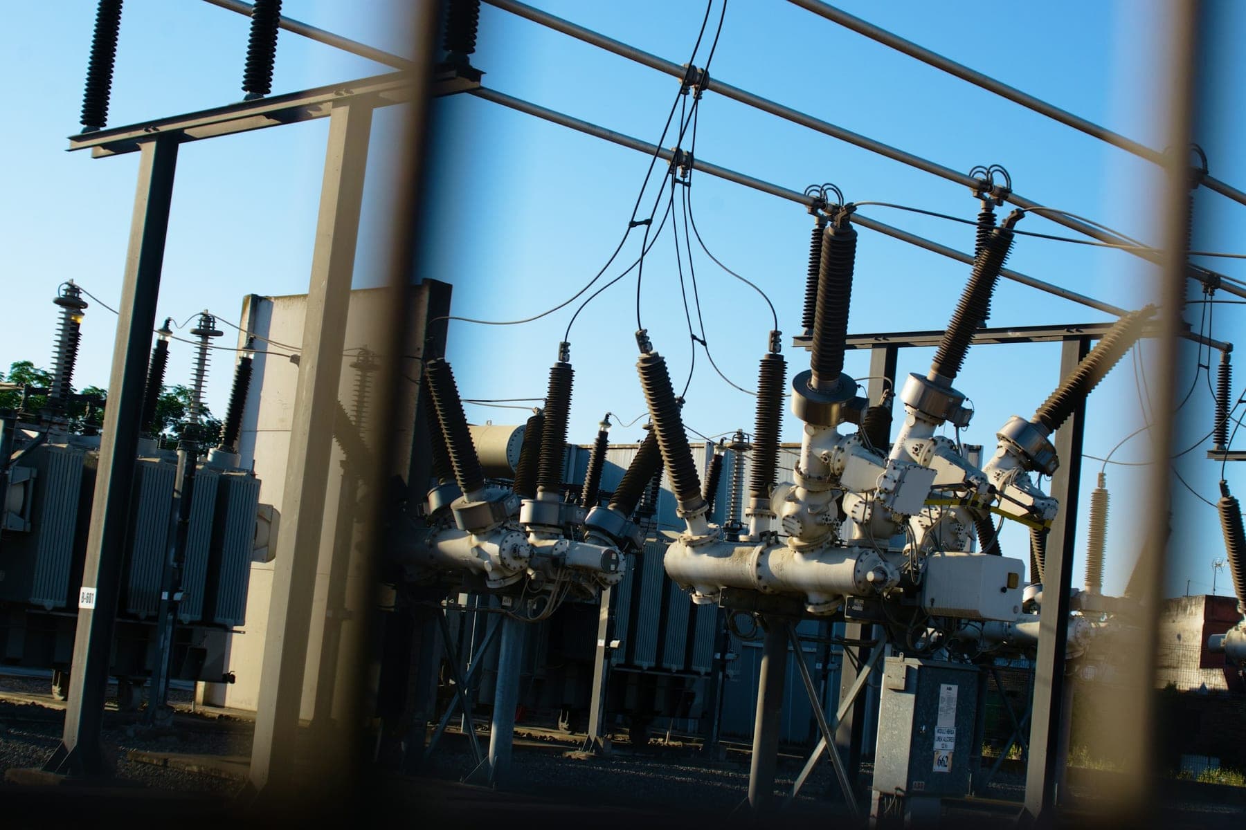 High-voltage circuit breakers and insulator stacks in an outdoor substation
